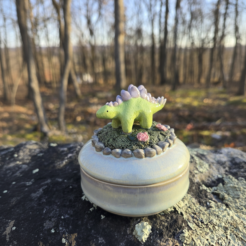 Dinosaur pottery piece